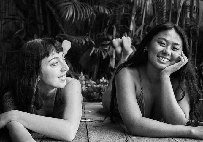 Women lay on front in forest